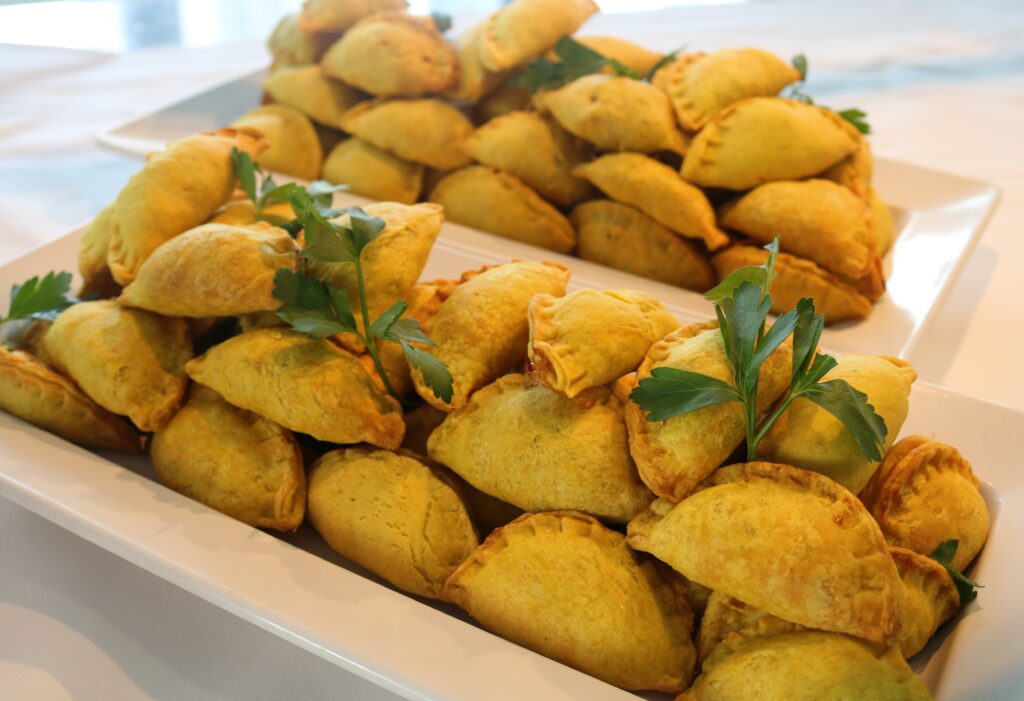 Platter stacked with golden cocktail patties